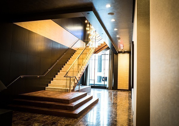 1 Franklin Street, Unit PH 2D Boston, MA 02110 - Photo 9 of 26 a view of entryway and hall with wooden floor