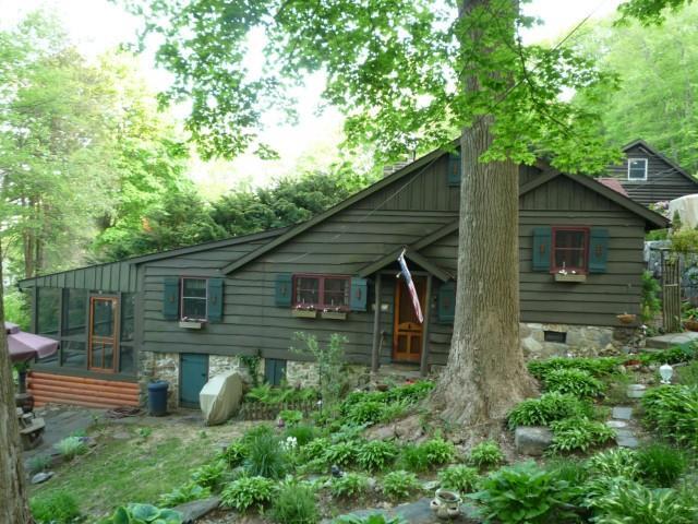 17 Overlook Road New Fairfield, CT 06812 - Photo 1 of 1 a view of a backyard with plants and large tree