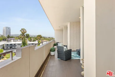 a kitchen with stainless steel appliances kitchen island granite countertop lots of counter top space