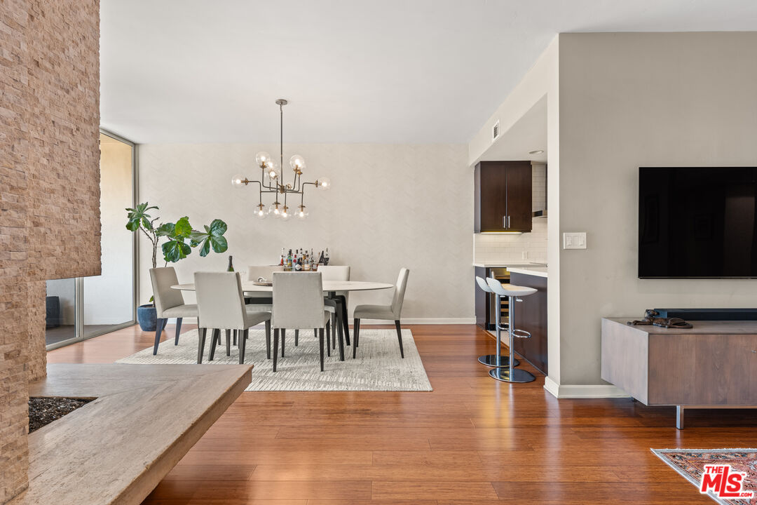 1333 South Beverly Glen Boulevard, Unit 703 Los Angeles, CA 90024 - Photo 5 of 18 a view of a dining room with furniture and wooden floor