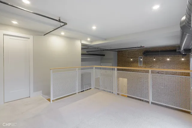 a bedroom with furniture and a painting