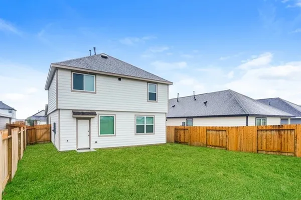 a view of front of house with a yard