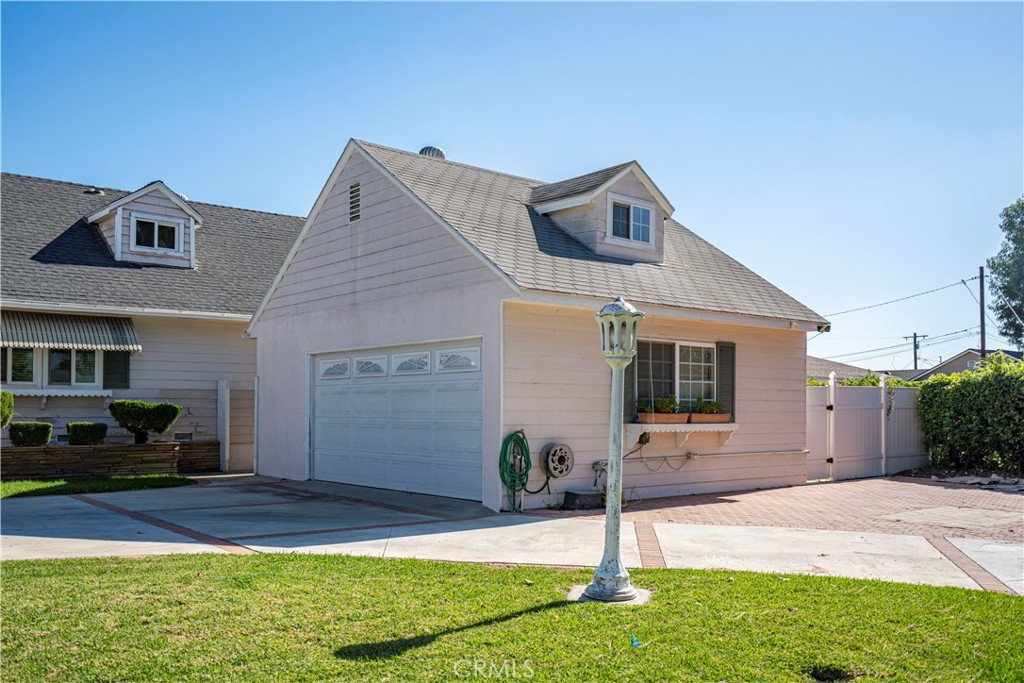 12100 Colima Road Whittier, CA 90604 - Photo 3 of 17 a front view of a house with garden