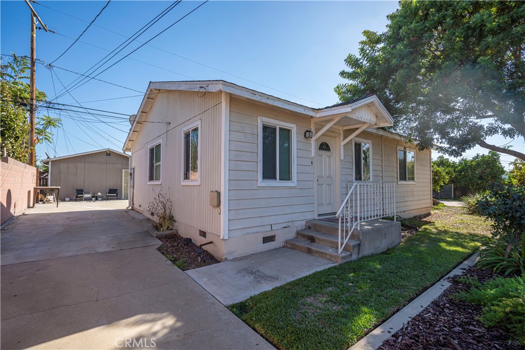 12100 Colima Road Whittier, CA 90604 - Photo 7 of 17 a view of a house with a yard