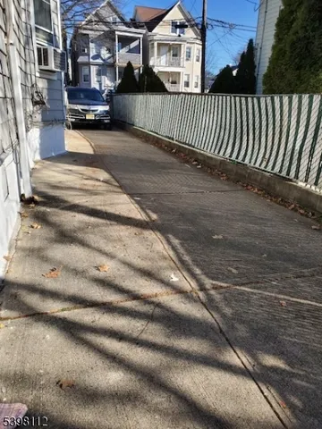 a view of a house with a street