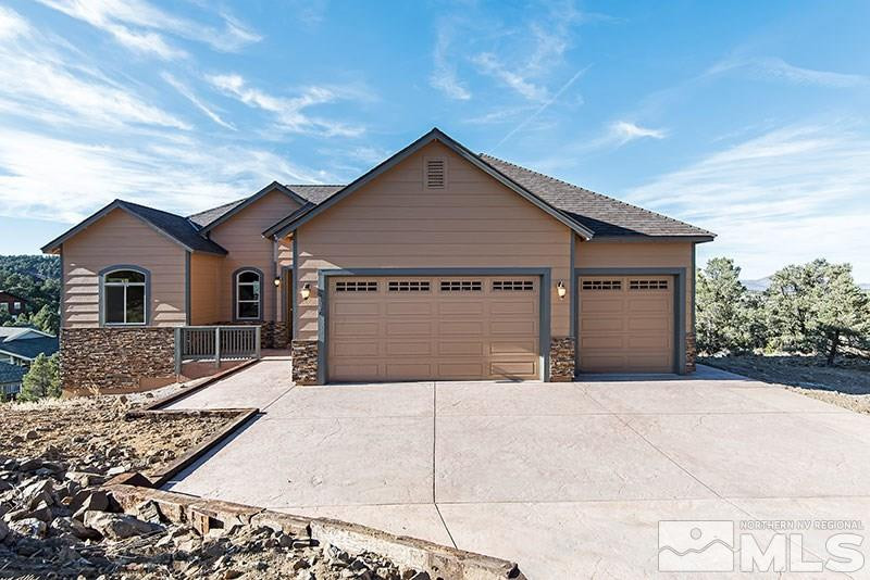 a front view of a house with garage