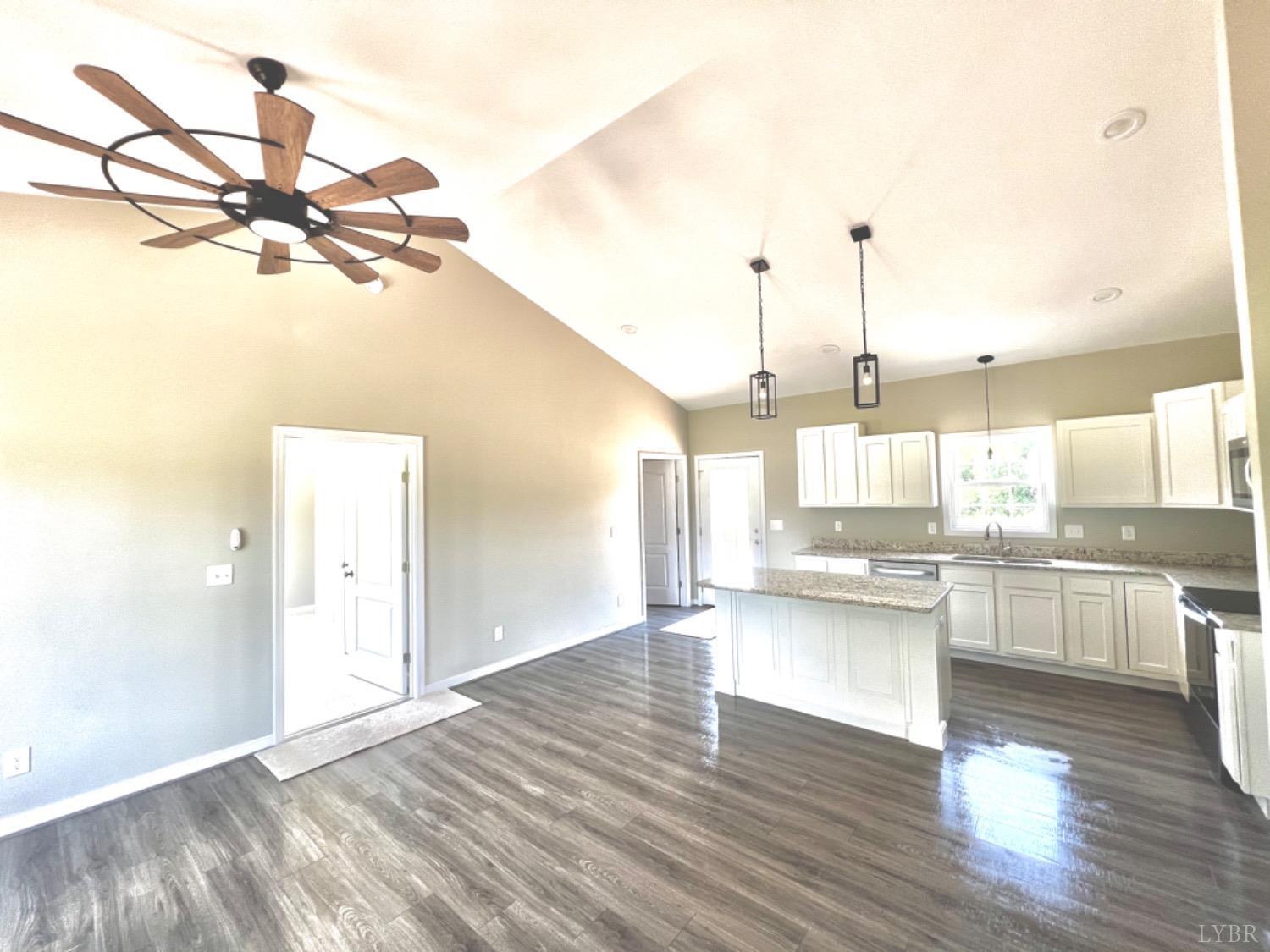 4922 Worsham Road Green Bay, VA 23942 - Photo 4 of 15 a view of a kitchen with wooden floor and a window