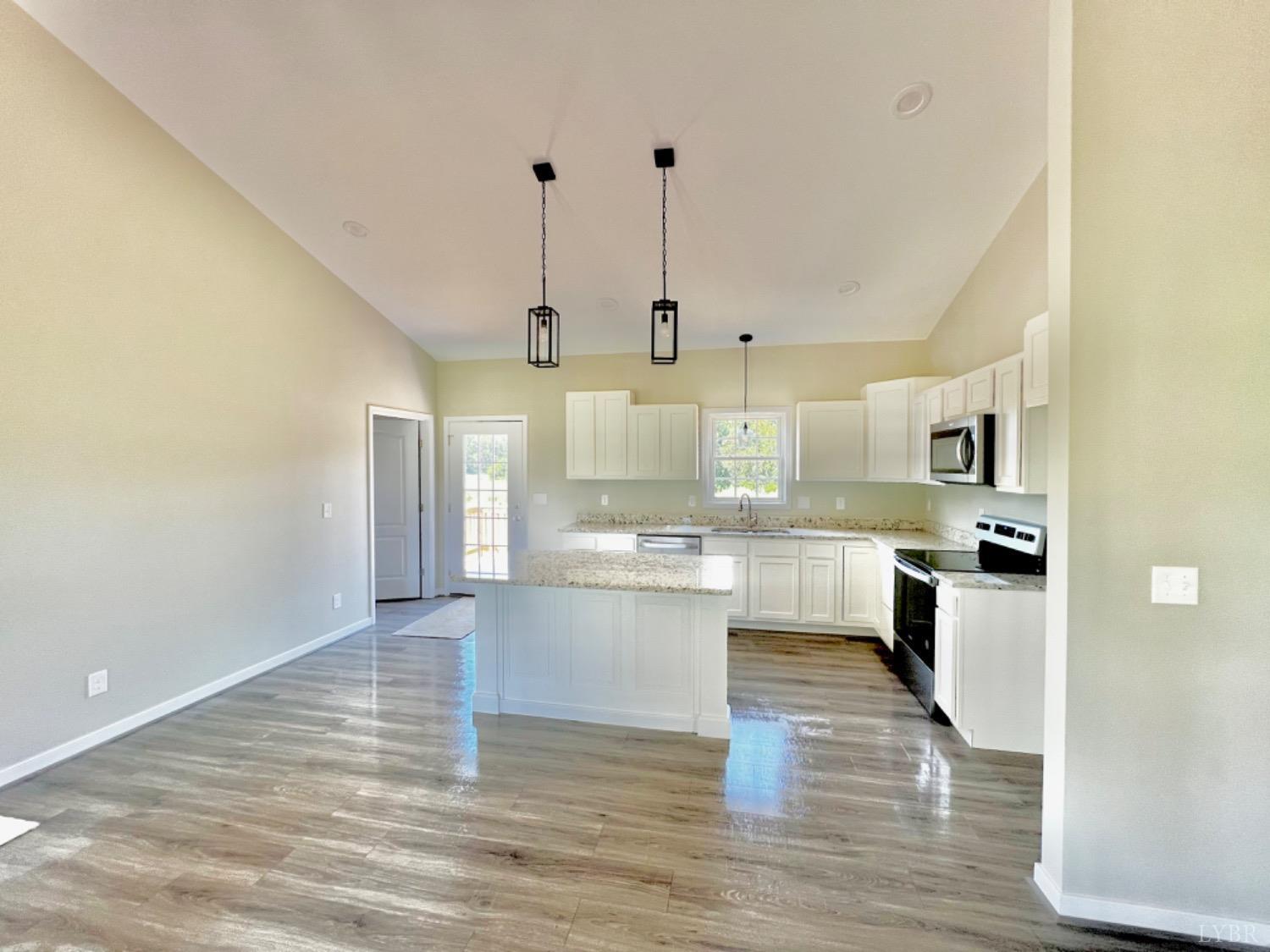 4922 Worsham Road Green Bay, VA 23942 - Photo 5 of 15 a large kitchen with cabinets and wooden floor