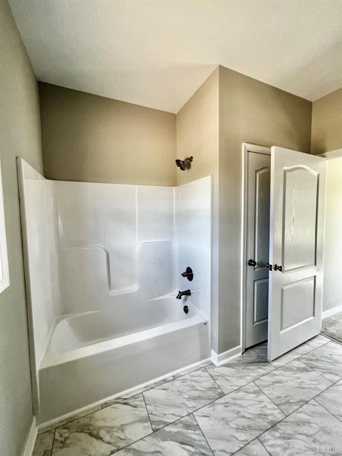 4922 Worsham Road Green Bay, VA 23942 - Photo 10 of 15 a bathroom with a bathtub and a shower