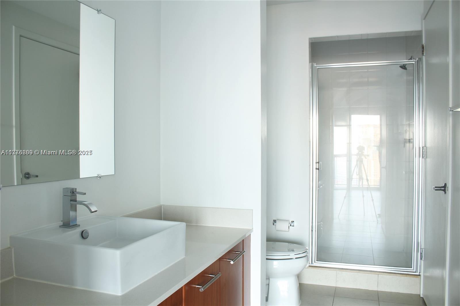 3301 Northeast 1st Avenue, Unit H2904 Miami, FL 33137 - Photo 10 of 15 a bathroom with a sink toilet and shower