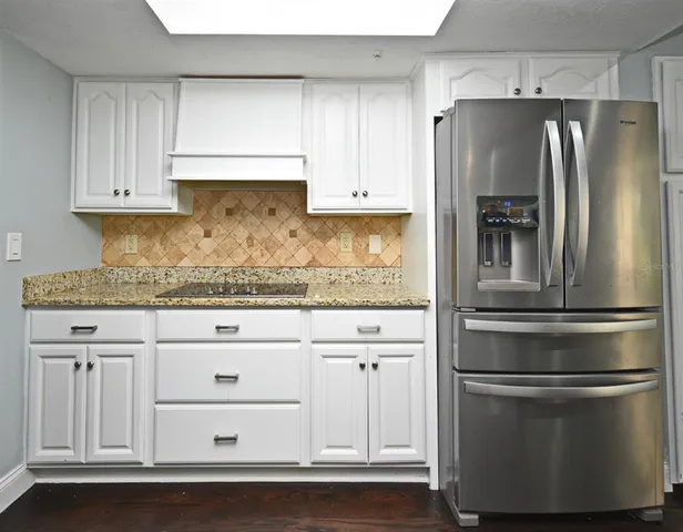 a view of a room with toys and wooden floor