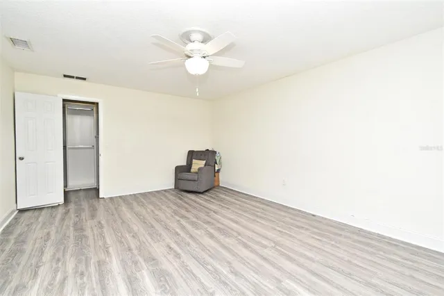 a view of walk in closet with clothes