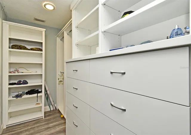 a view of balcony with chairs and wooden fence