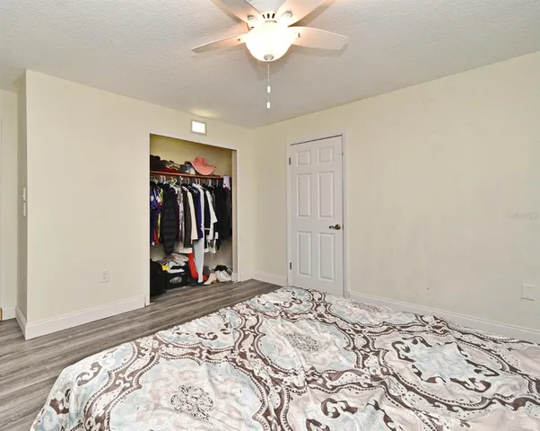 a view of a house with pool and a yard