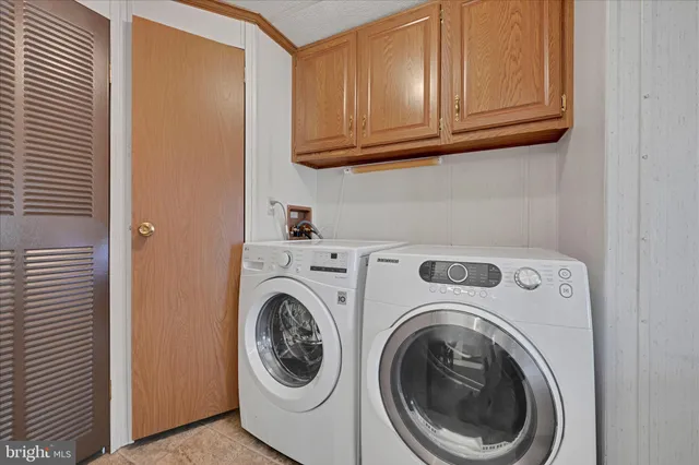 a view of bathroom with washer and dryer