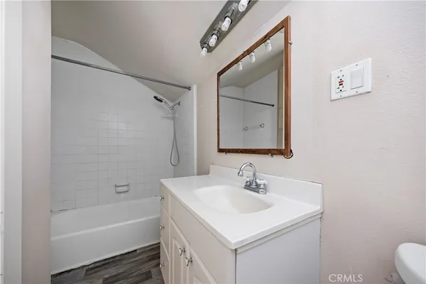 a bathroom with a sink toilet and a bathtub