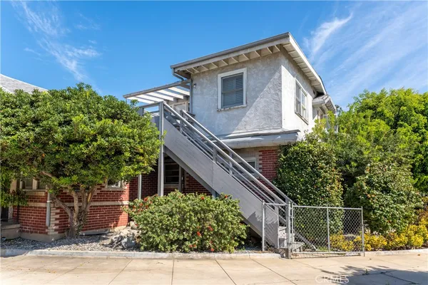 a view of a house with a small yard