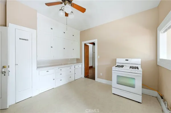 a kitchen with a stove oven and a refrigerator