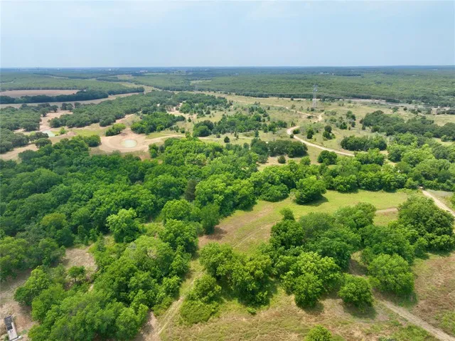 a view of a swimming pool with a yard