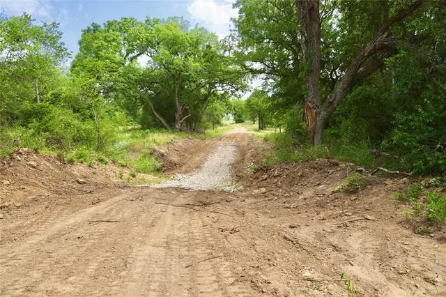 a view of a road with ocean view