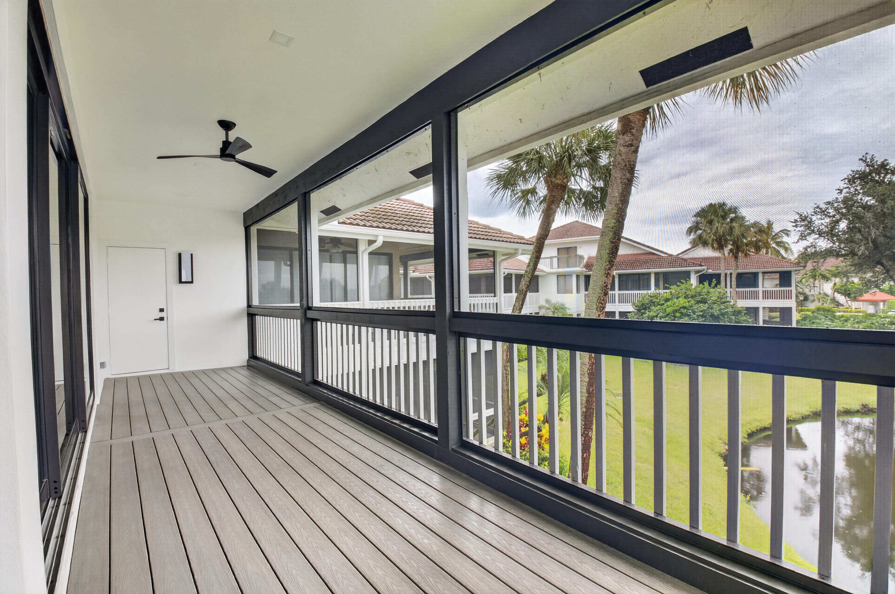 19221 Sabal Lake Drive, Unit 5124 Boca Raton, FL 33434 - Photo 23 of 98 a view of a porch with wooden floor in an outdoor space