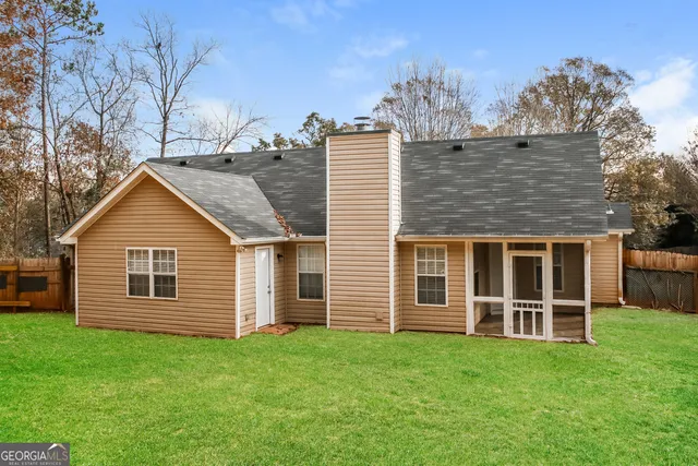 a kitchen that has a sink a refrigerator and window