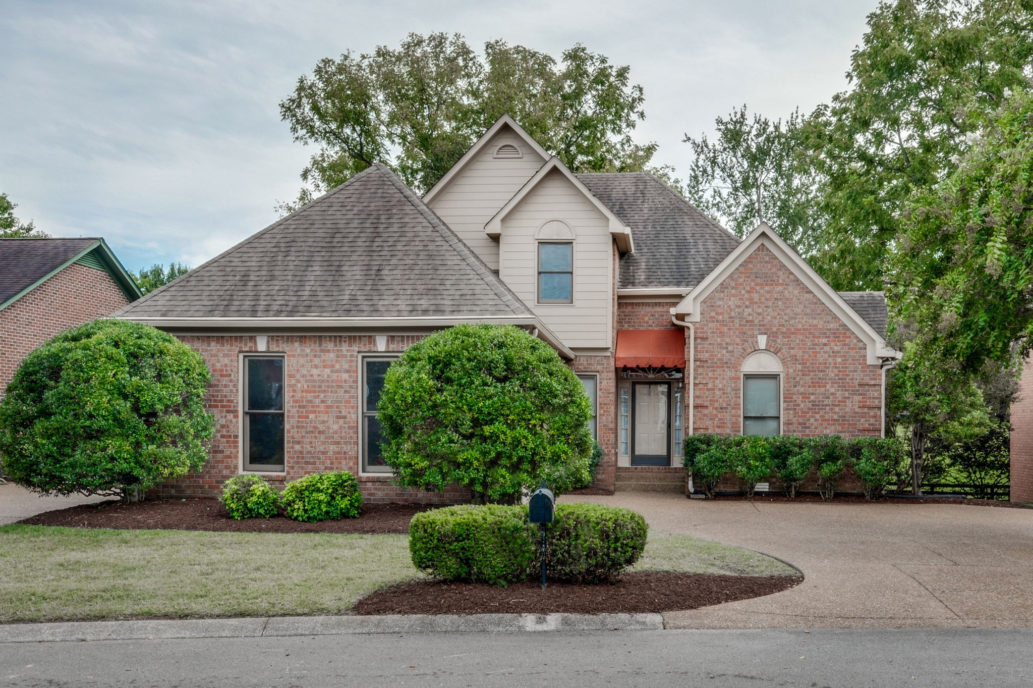 1705 Fieldcrest Circle Franklin, TN 37064 - Photo 1 of 45 a front view of a house with a yard and garage