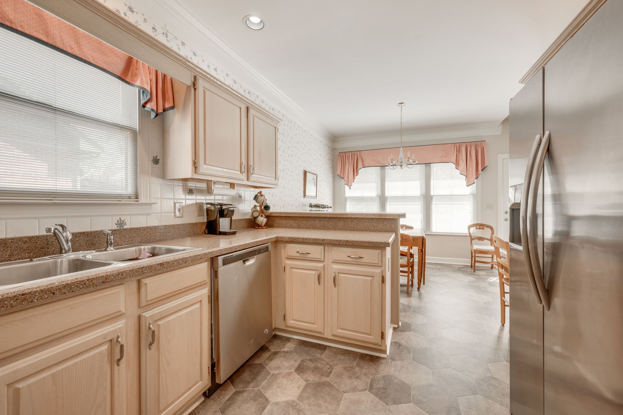 1705 Fieldcrest Circle Franklin, TN 37064 - Photo 11 of 45 a kitchen with a sink refrigerator and cabinets