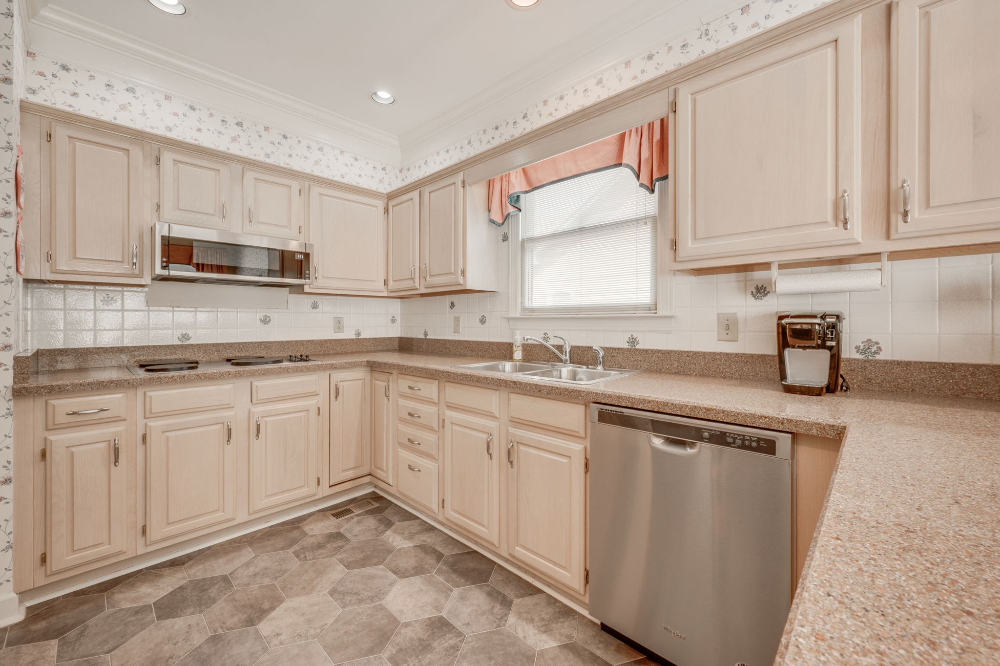 1705 Fieldcrest Circle Franklin, TN 37064 - Photo 13 of 45 a kitchen with cabinets appliances a sink and a counter top space
