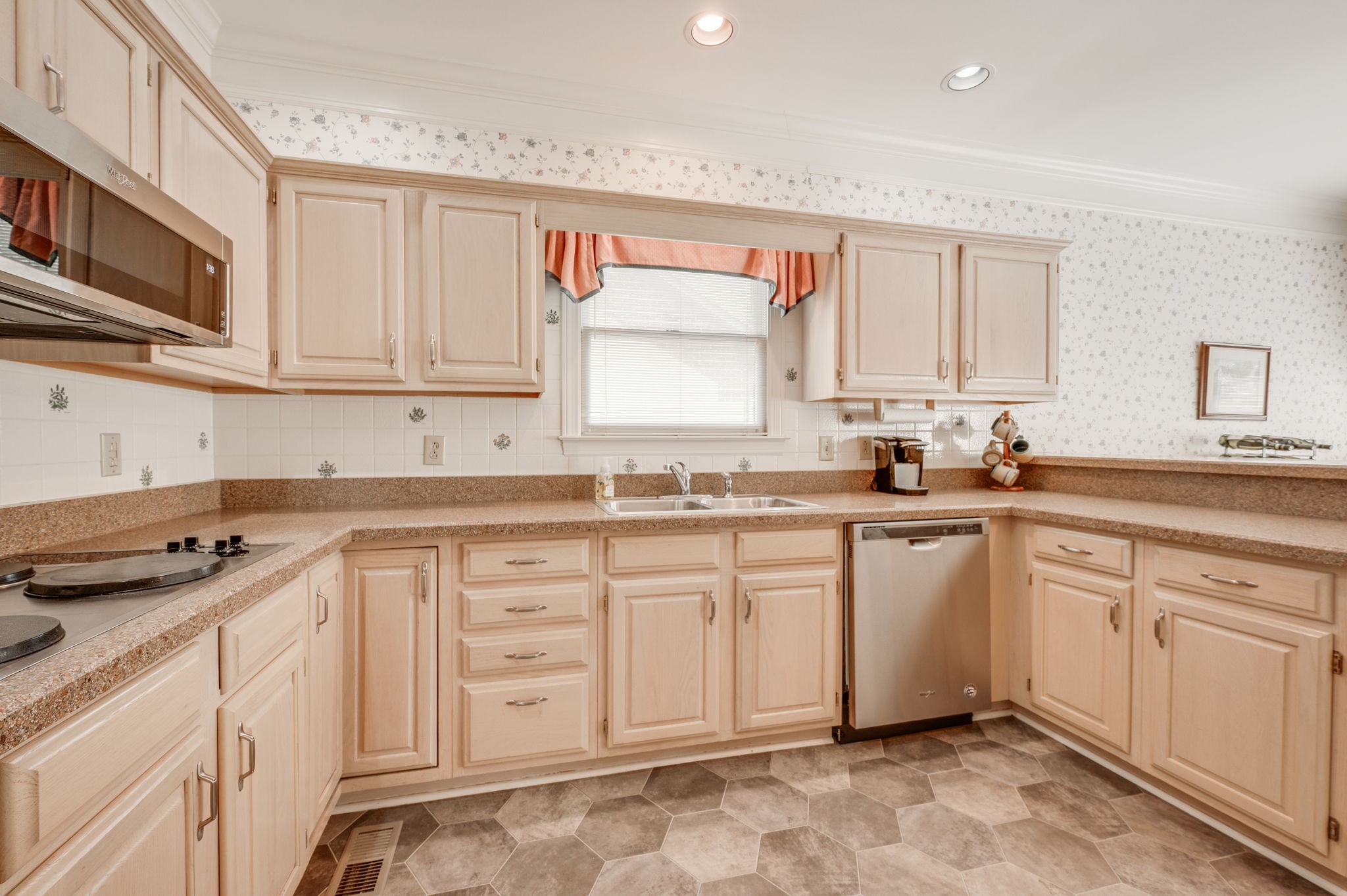 1705 Fieldcrest Circle Franklin, TN 37064 - Photo 15 of 45 a kitchen with granite countertop white cabinets stainless steel appliances a sink and a window