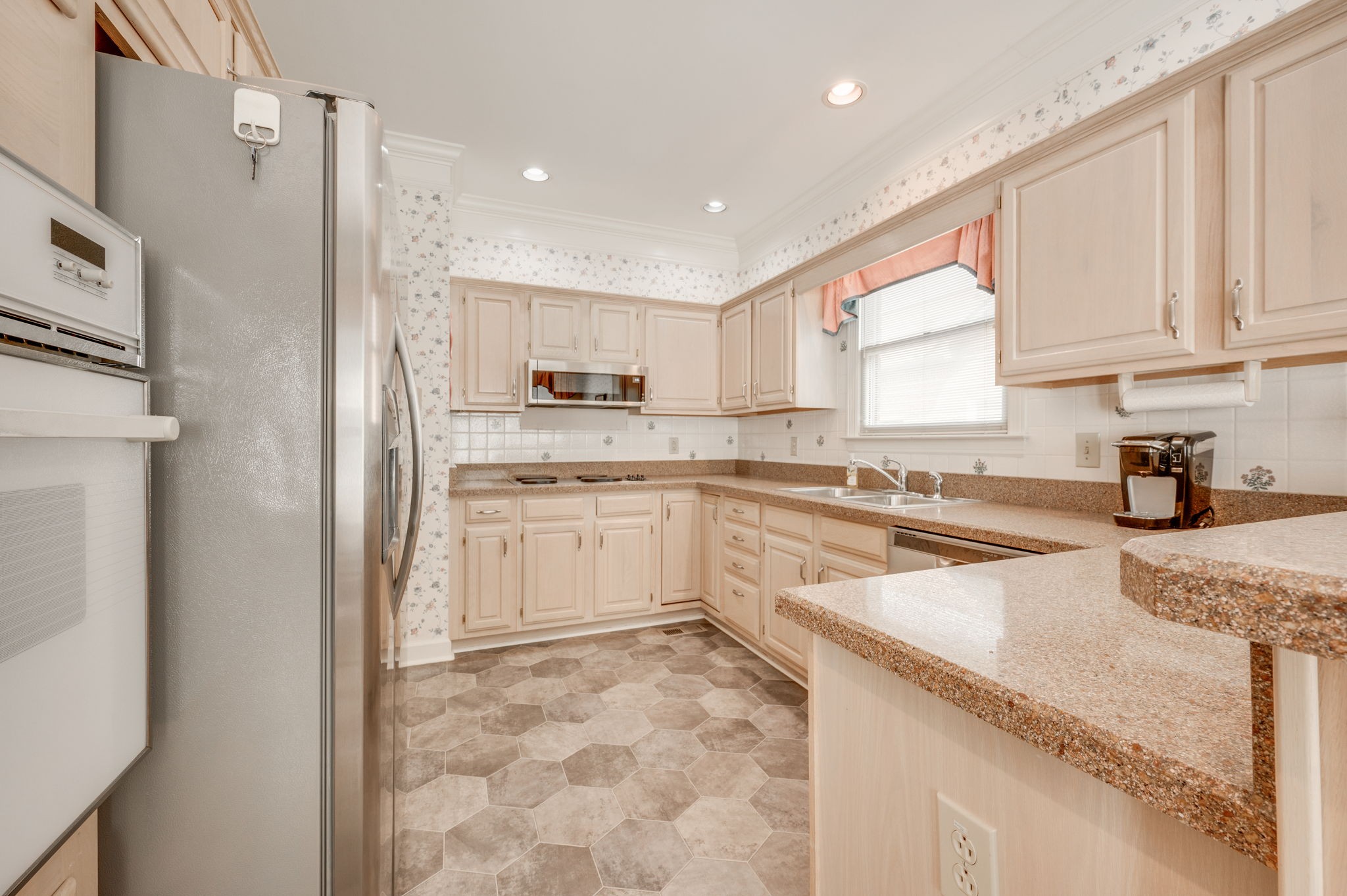 1705 Fieldcrest Circle Franklin, TN 37064 - Photo 17 of 45 a kitchen with white cabinets and white appliances
