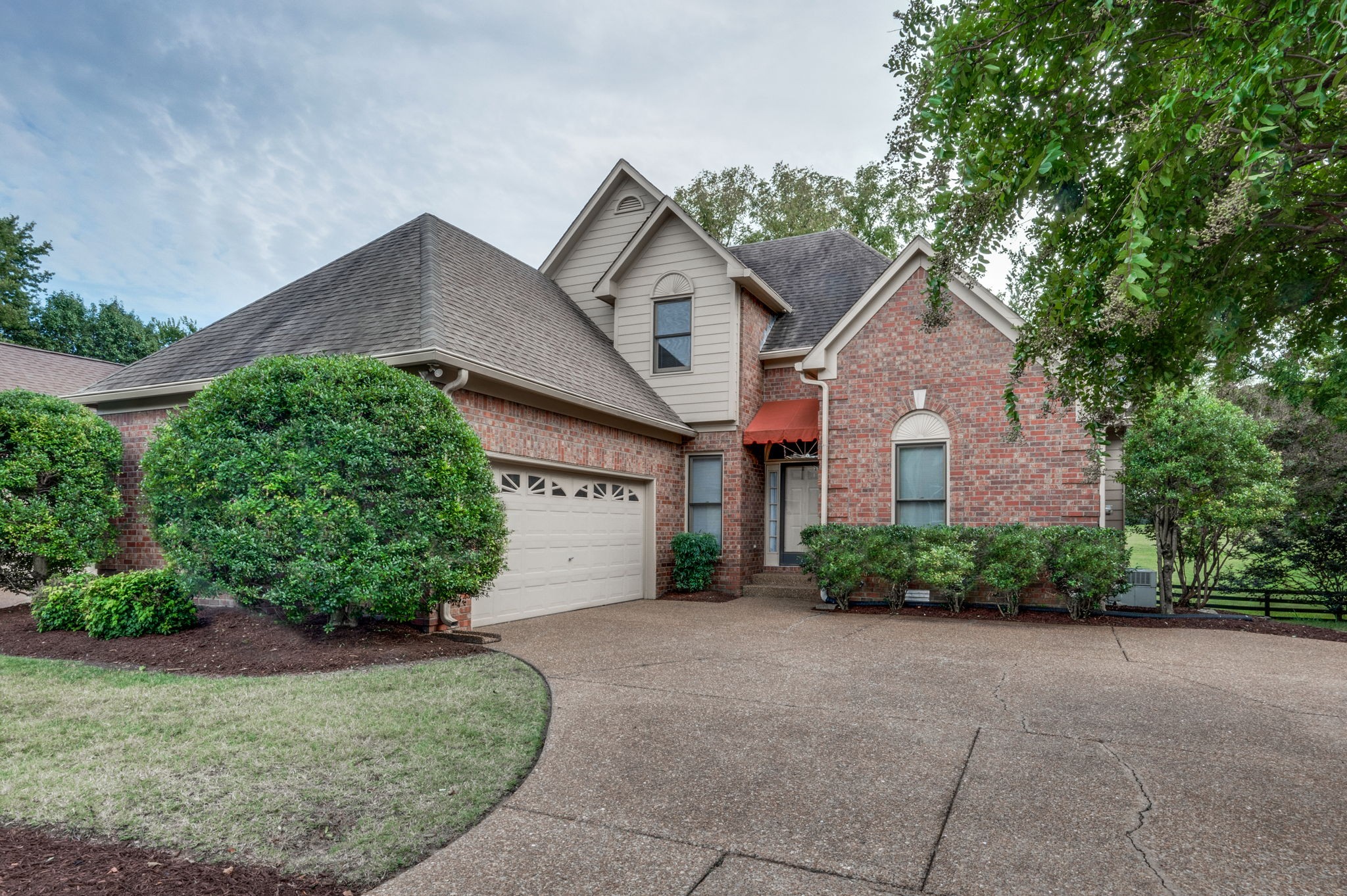1705 Fieldcrest Circle Franklin, TN 37064 - Photo 2 of 45 a front view of a house with a yard and garage