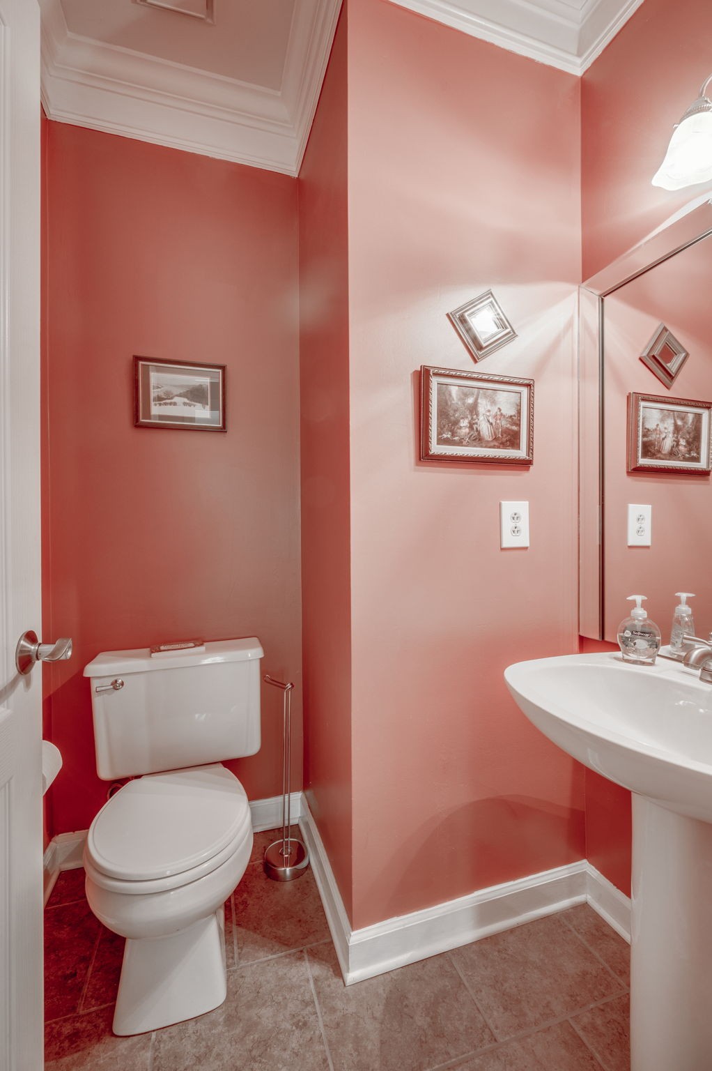 1705 Fieldcrest Circle Franklin, TN 37064 - Photo 25 of 45 a white toilet sitting next to a bathroom sink