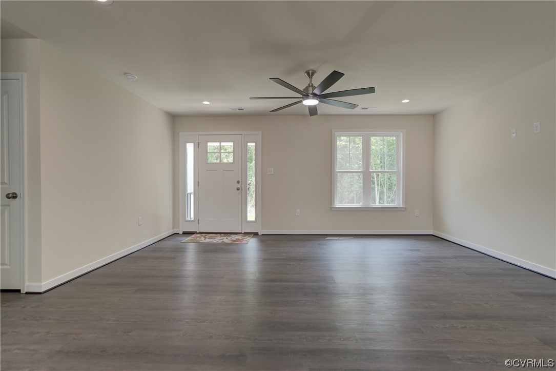 400 New S Ridge Road Bumpass, VA 23024 - Photo 11 of 41 an empty room with wooden floor and windows
