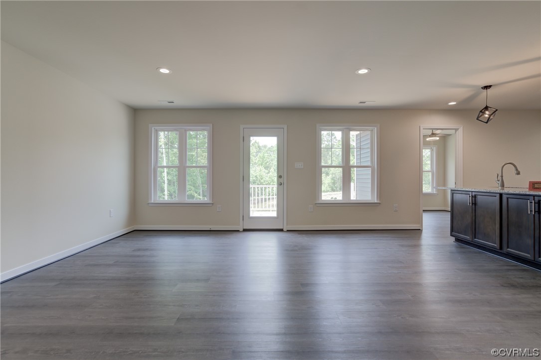 400 New S Ridge Road Bumpass, VA 23024 - Photo 12 of 41 an empty room with wooden floor and windows