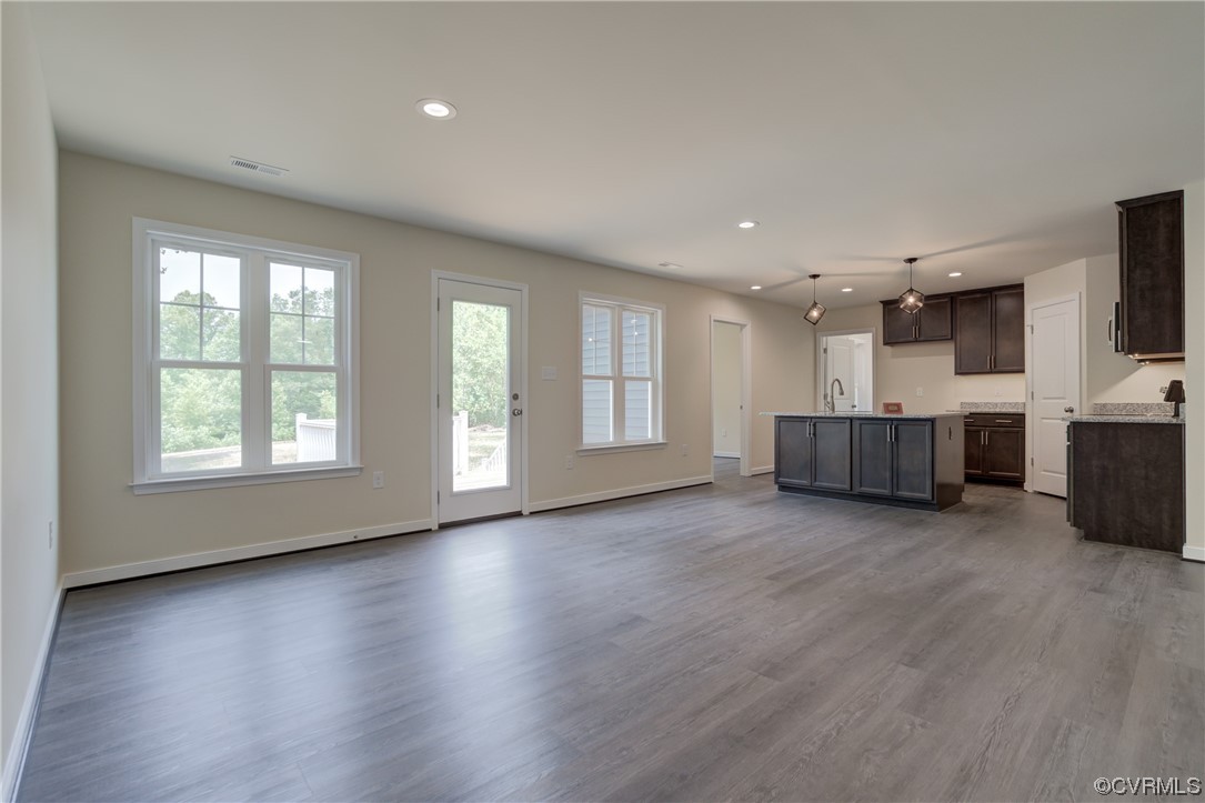 400 New S Ridge Road Bumpass, VA 23024 - Photo 13 of 41 a view of an empty room with a window and fireplace