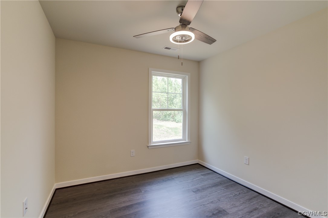 400 New S Ridge Road Bumpass, VA 23024 - Photo 20 of 41 an empty room with wooden floor and windows