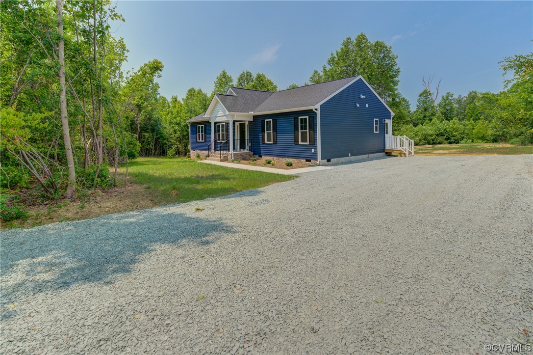 400 New S Ridge Road Bumpass, VA 23024 - Photo 3 of 41 a front view of a house with yard