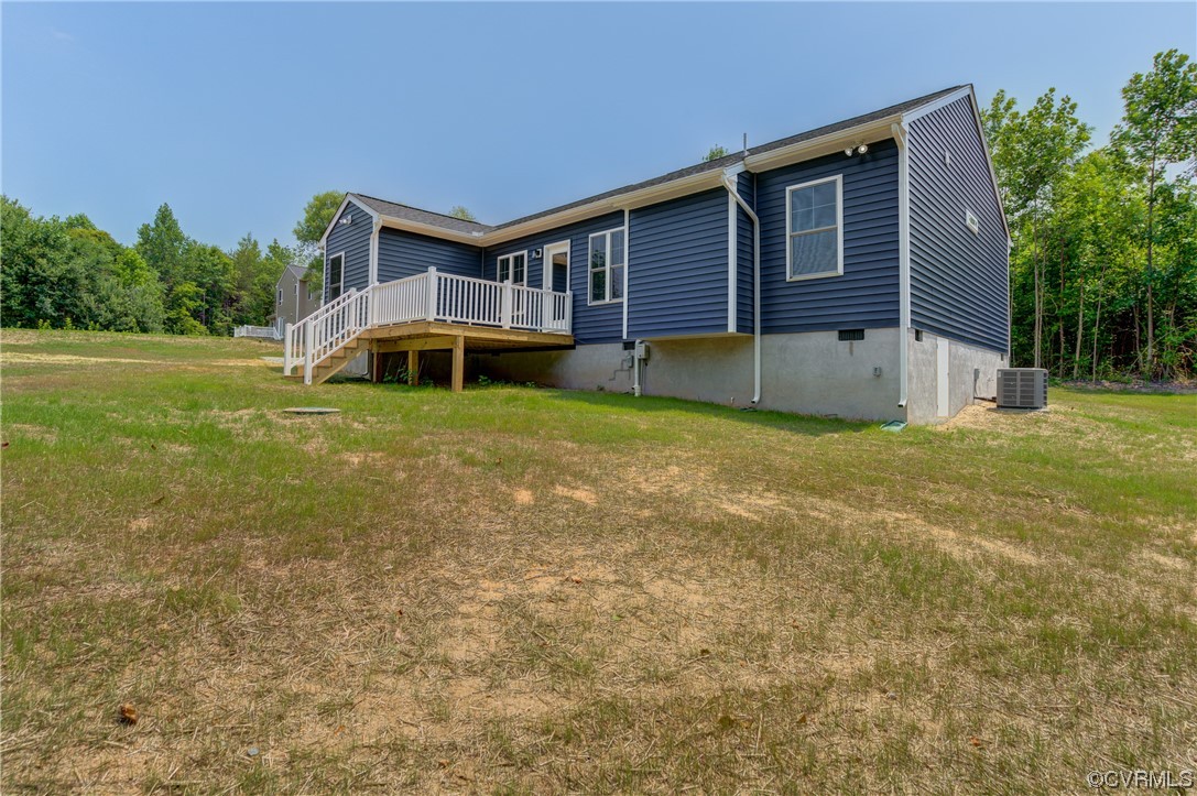 400 New S Ridge Road Bumpass, VA 23024 - Photo 33 of 41 a front view of house with yard and trees in the background