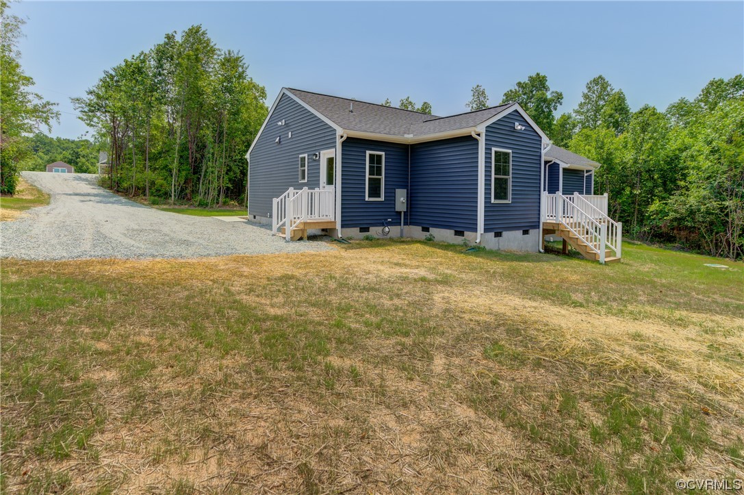 400 New S Ridge Road Bumpass, VA 23024 - Photo 34 of 41 a view of a house with a yard and garage