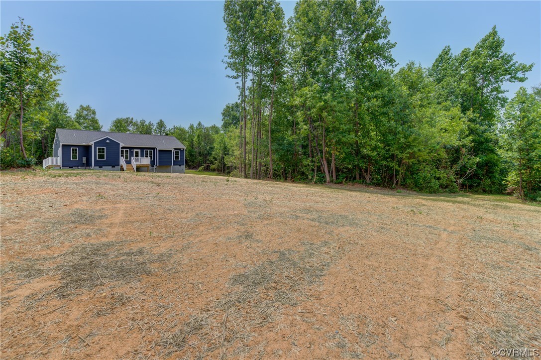 400 New S Ridge Road Bumpass, VA 23024 - Photo 37 of 41 a front view of a house with a yard and trees