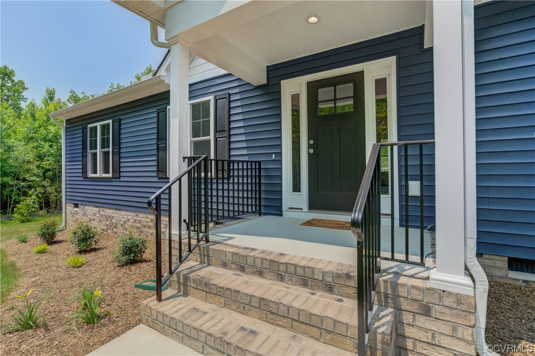 400 New S Ridge Road Bumpass, VA 23024 - Photo 5 of 41 a front view of a house with a porch