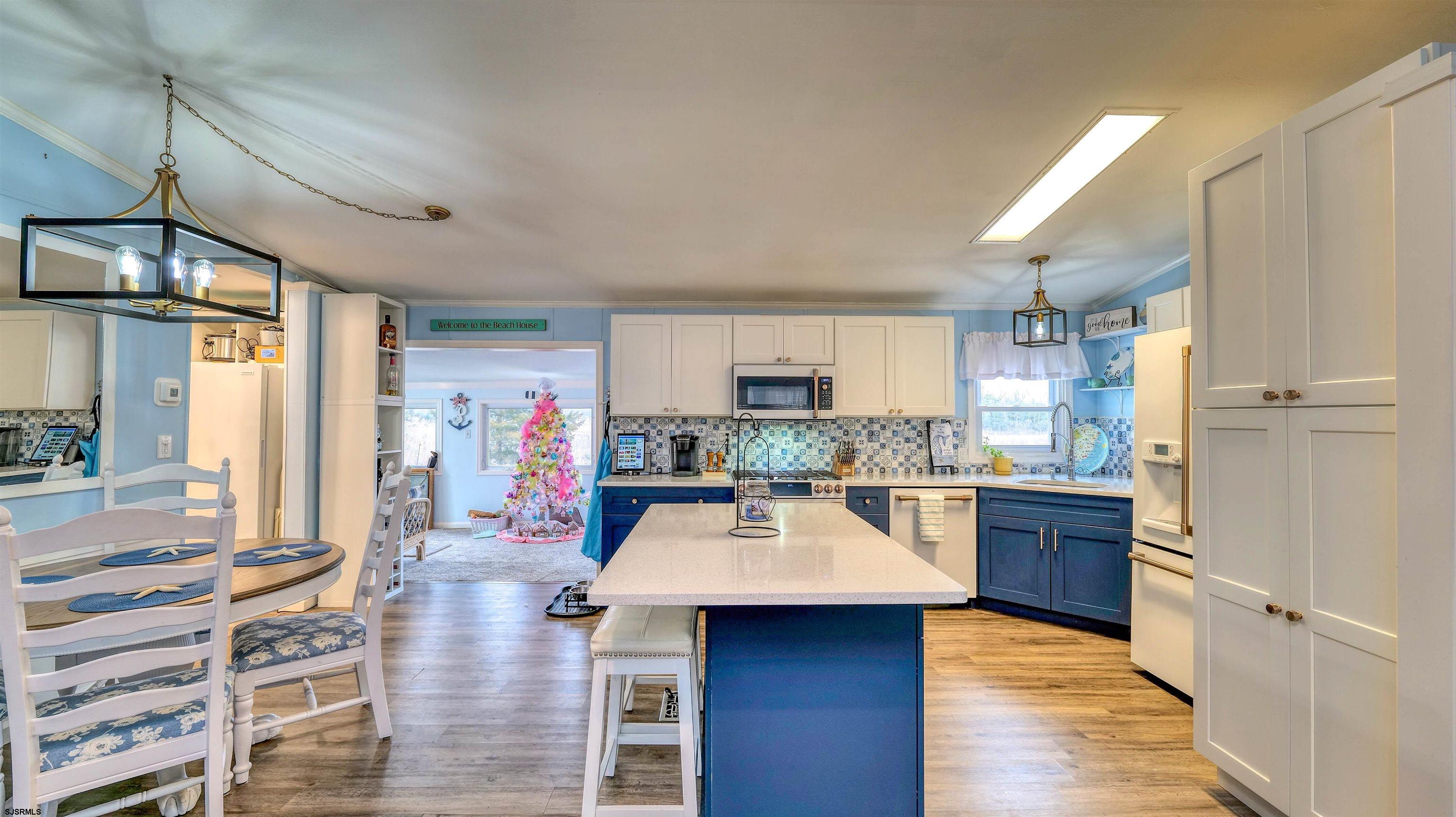33 Defeo Lane Somers Point, NJ 08244 - Photo 12 of 29 a kitchen with stainless steel appliances kitchen island granite countertop a refrigerator and a stove top oven