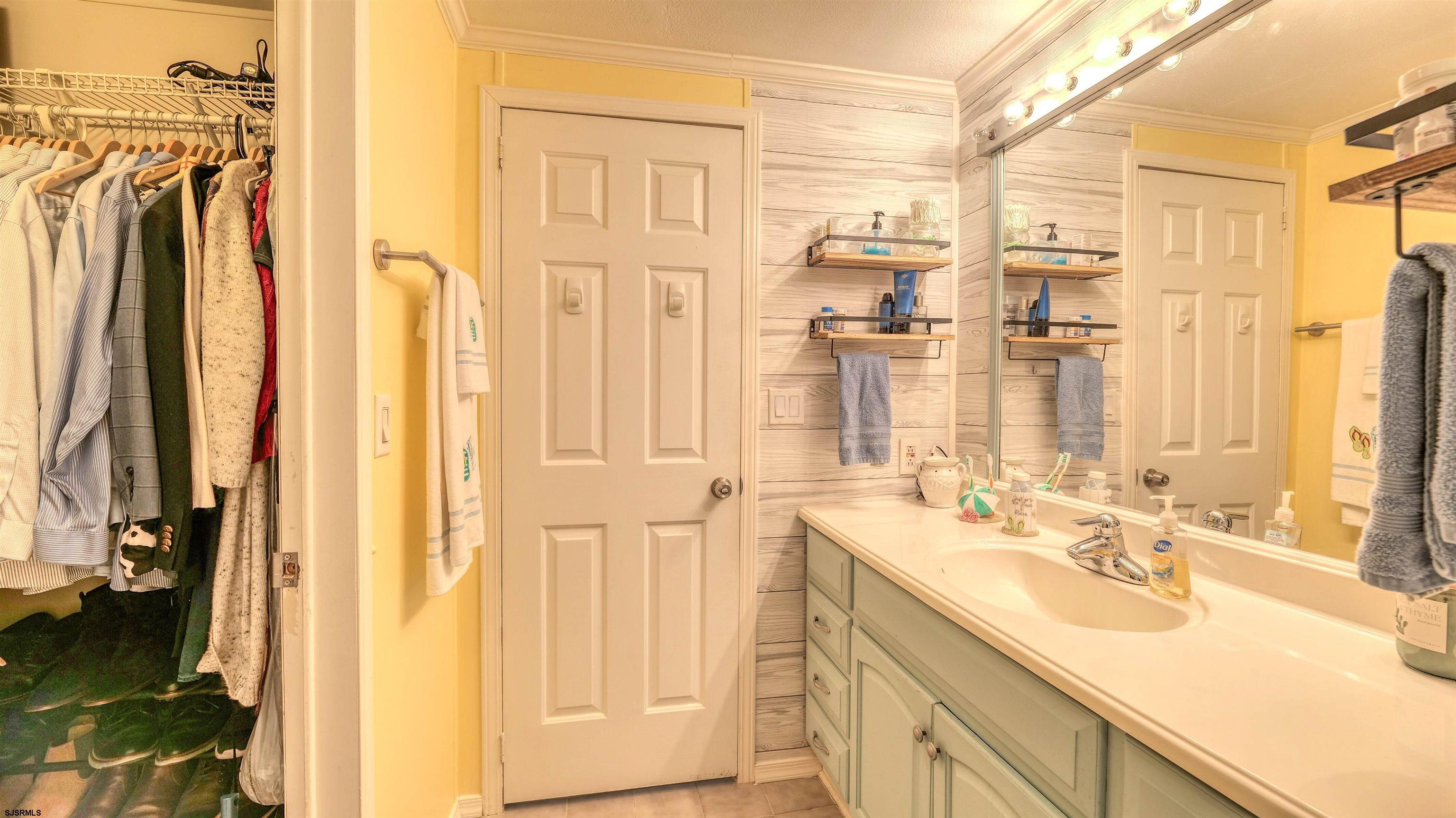 33 Defeo Lane Somers Point, NJ 08244 - Photo 17 of 29 a bathroom with a double vanity sink a mirror and a shower