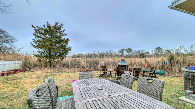 a view of roof deck with couches and city view