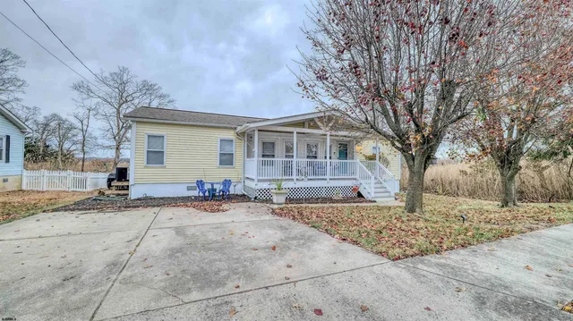 a backyard of a house with seating space