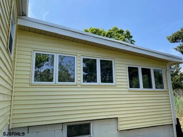 a view of a windows in back of the house