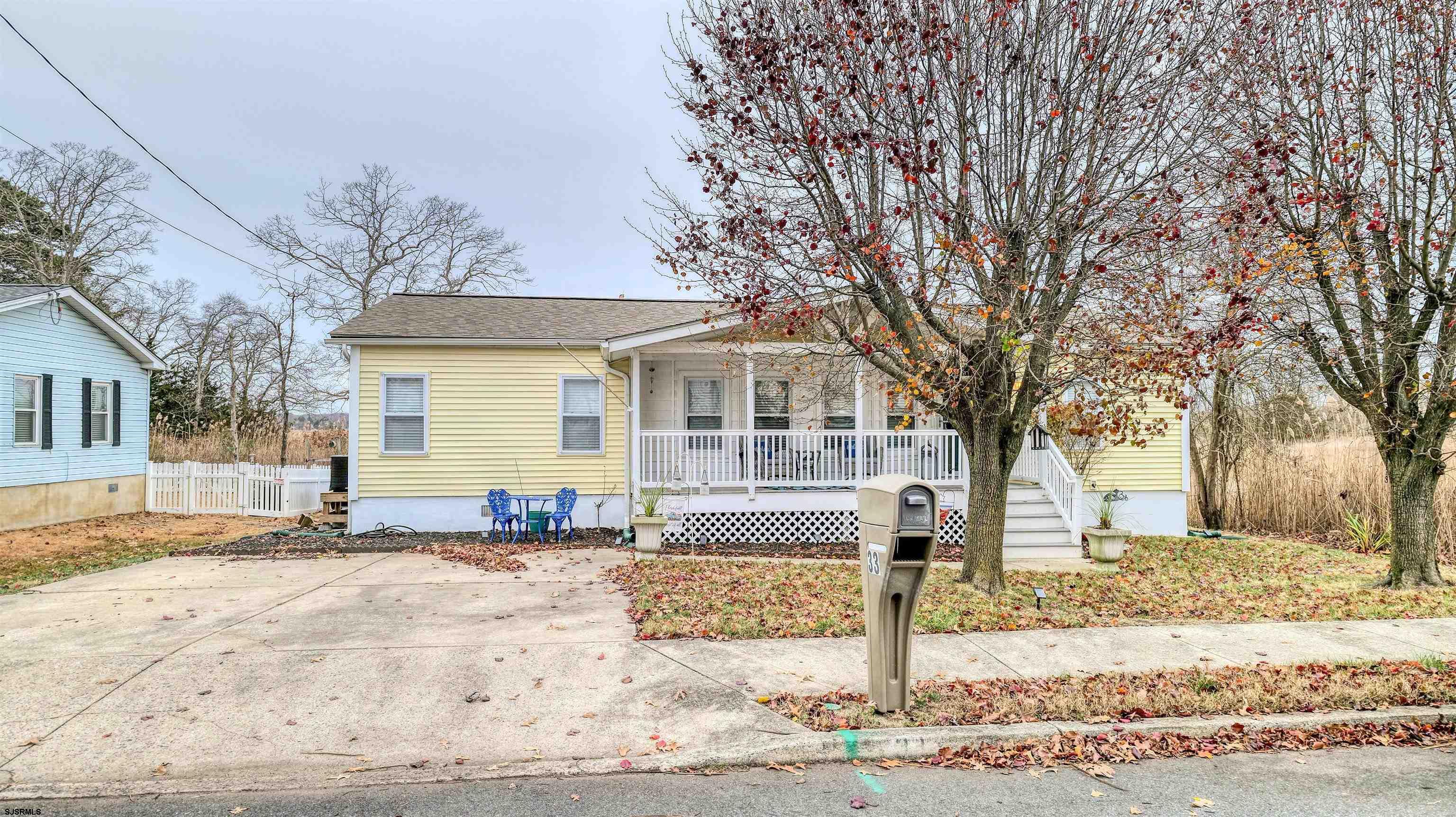 33 Defeo Lane Somers Point, NJ 08244 - Photo 3 of 29 a front view of a house with a yard