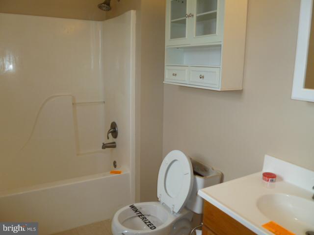 37 Frank Haines Road Paw Paw, WV 25434 - Photo 3 of 18 a bathroom with a tub and sink