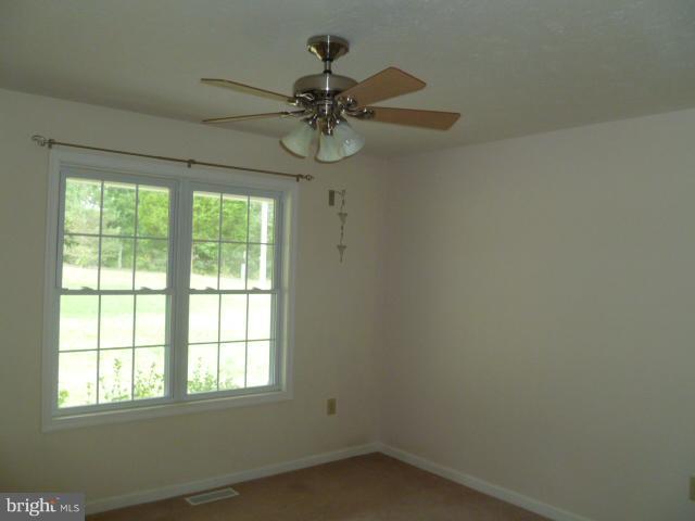 37 Frank Haines Road Paw Paw, WV 25434 - Photo 8 of 18 an empty room with a window